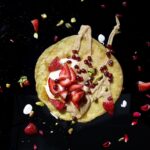 Gluten free chickpea crepe with strawberries and tahini